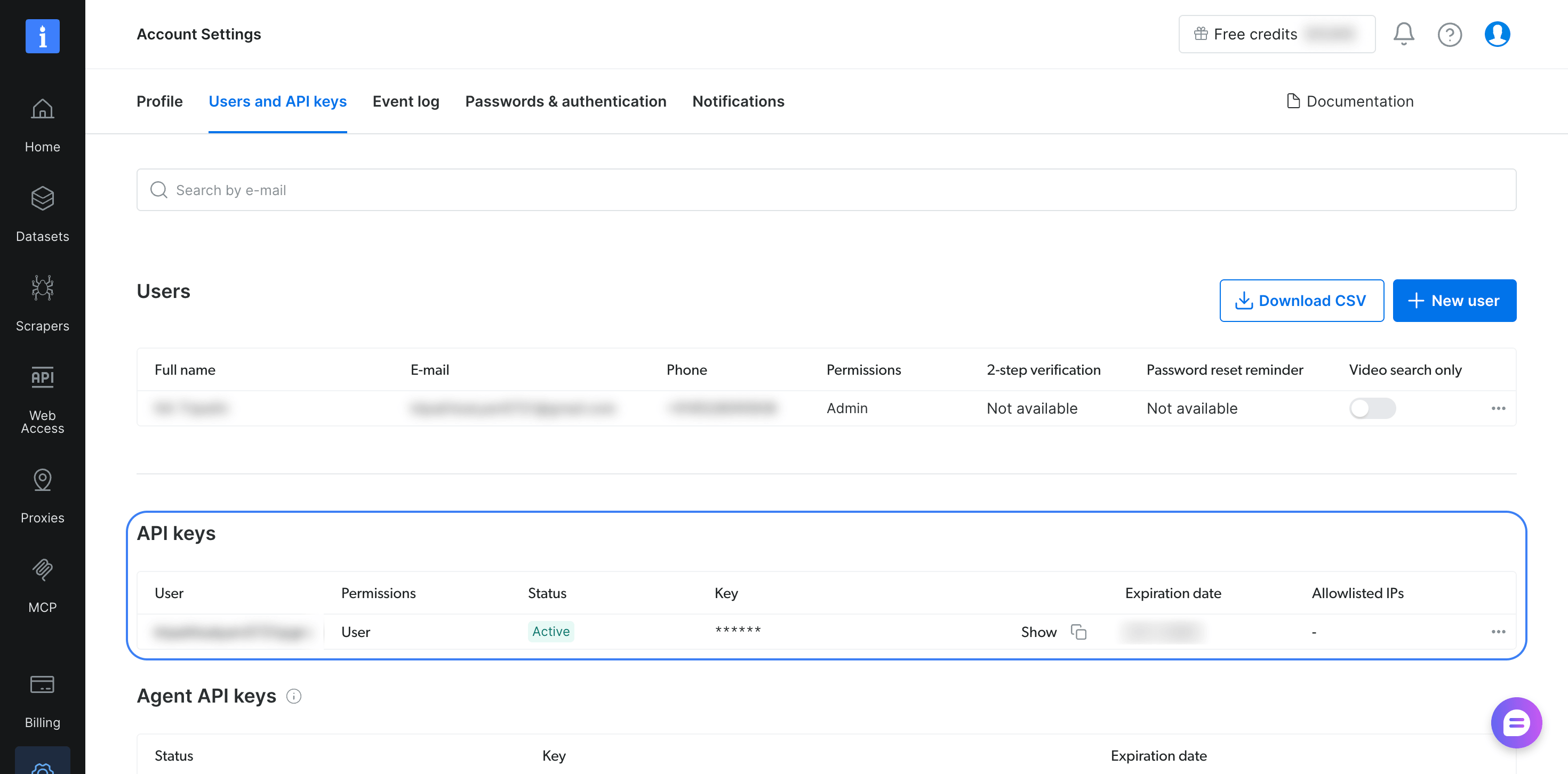 Bright Data control panel showing the Users and API keys tab of Account Settings. The outlined API keys table lists 1 key with User permissions, Active status, and the key hidden until you select Show. Account details are blurred.
